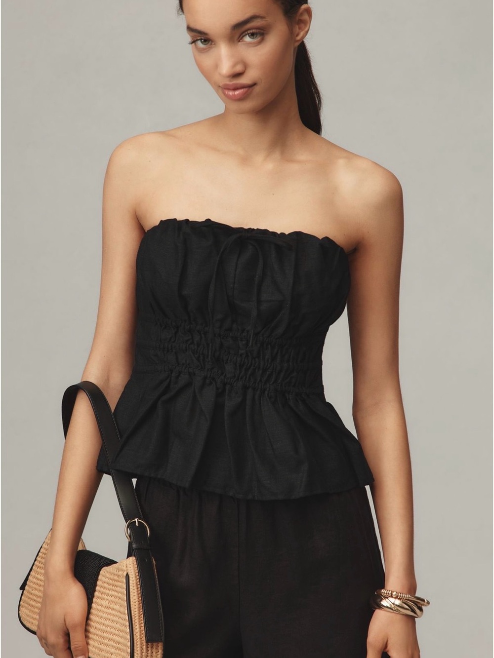 Anthropologie Strapless Smocked Peplum Top in Black